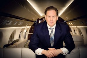 magellan jets ceo and founder joshua hebert aboard a private jet, he spoke with mirror review