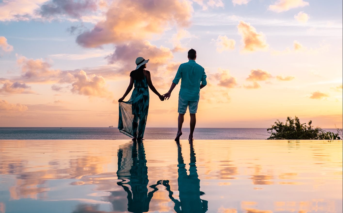 Couple watches sunset on St. Lucia best 2021 travel destinations