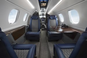 The interior of an Embraer Phenom 300E private jet