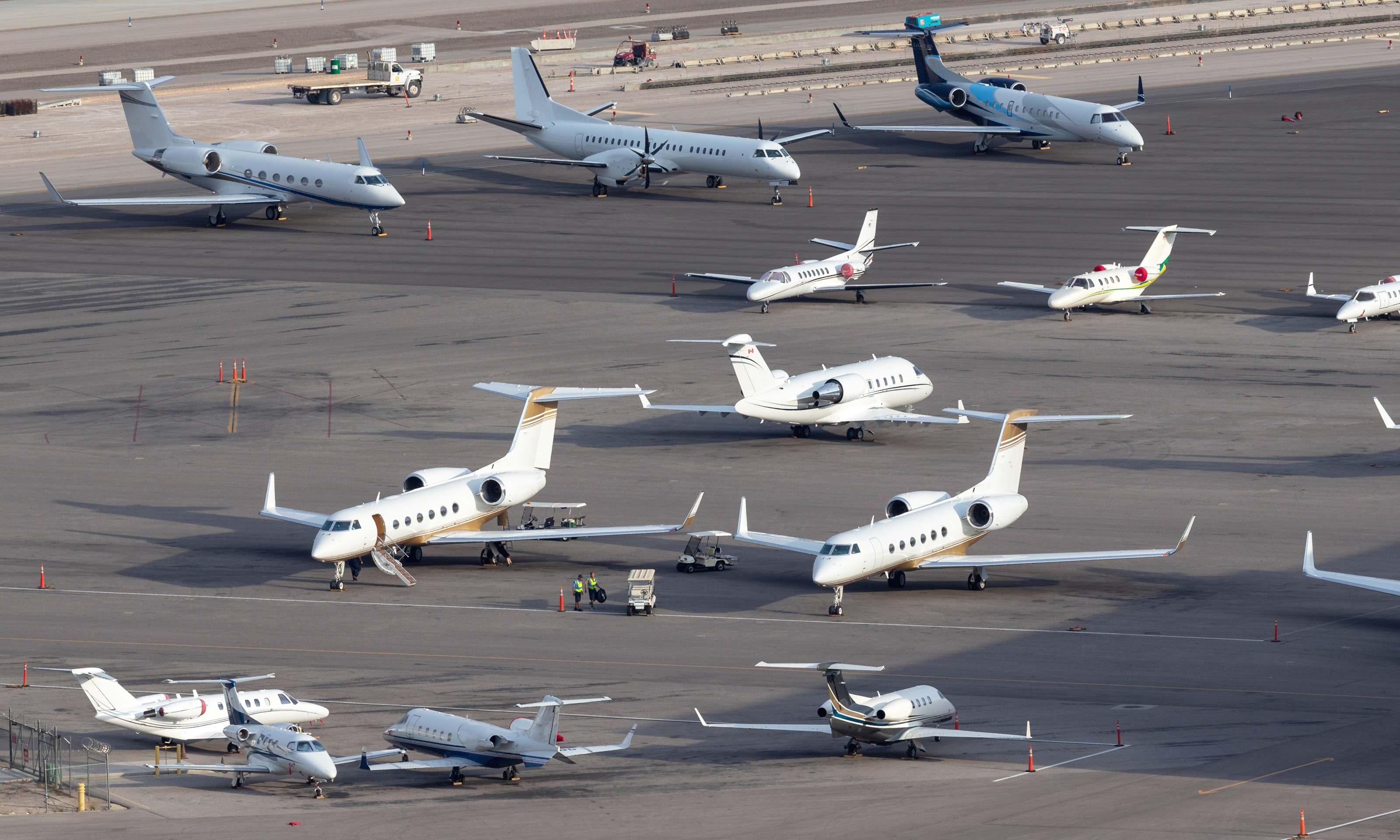 Las Vegas, Nevada, USA - May 5, 2013: Overview of the private jet ramp at McCarran International Airport Las Vegas with multiple luxury jets parked on the tarmac.