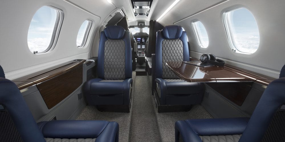 The interior of an Embraer Phenom 300E private jet