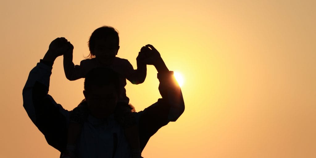 father's day dad with child on shoulder