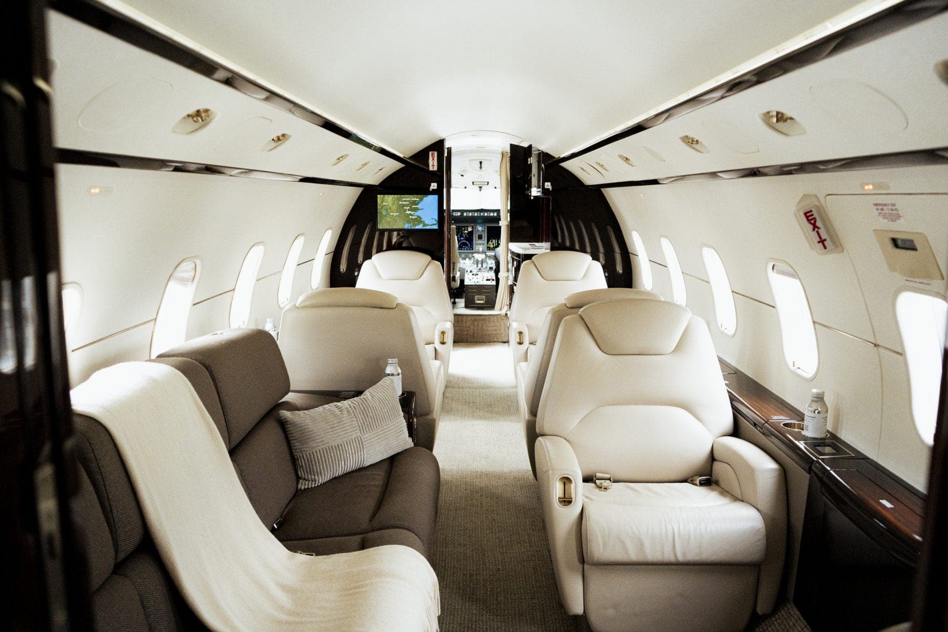 Challenger 300 interior cabin with seating and in-flight workspace