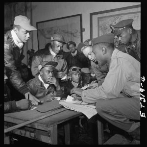 Tuskegee Airmen at a mission briefing