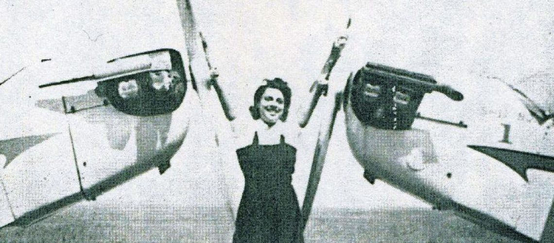 Willa Brown posing with planes.