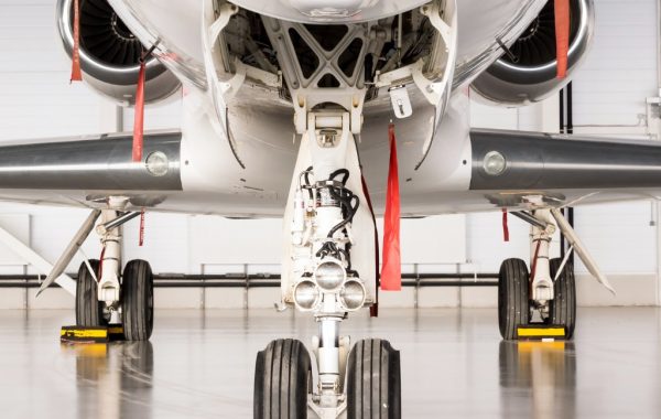 close up of wheels on business jet in hanger