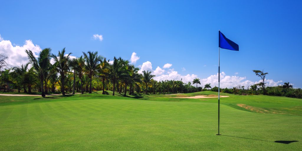 Beautiful landscape of a golf court with palm trees in Punta Cana, Dominican Republic