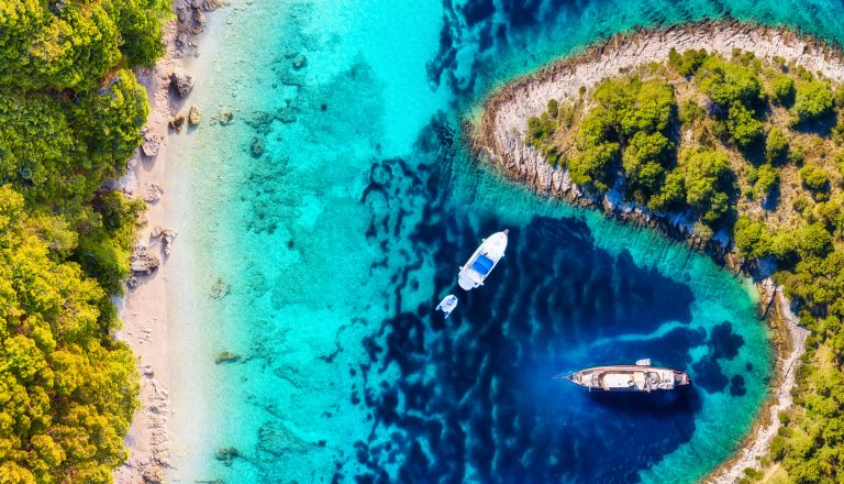 Yachts on the water surface from top view. Turquoise water panoramic background from drone. Summer seascape from air. Croatia. Travel - image