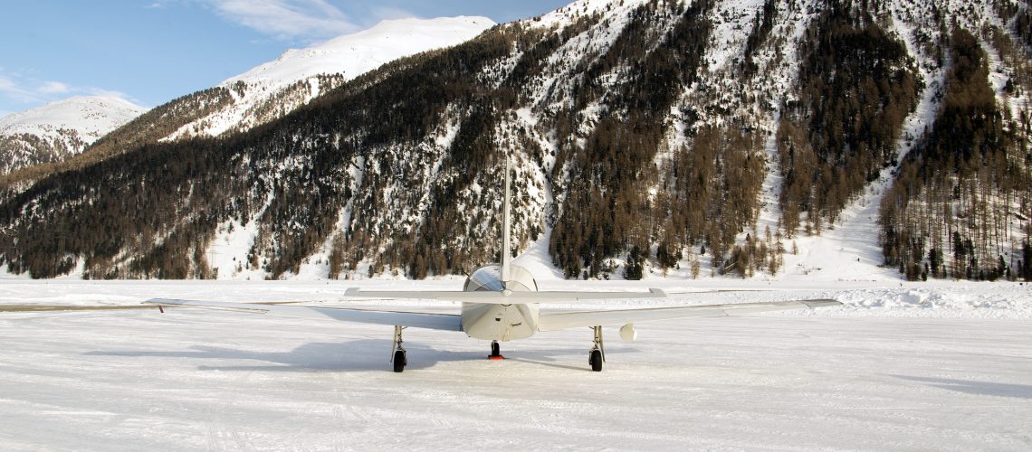 Private jet winter snow ice runway